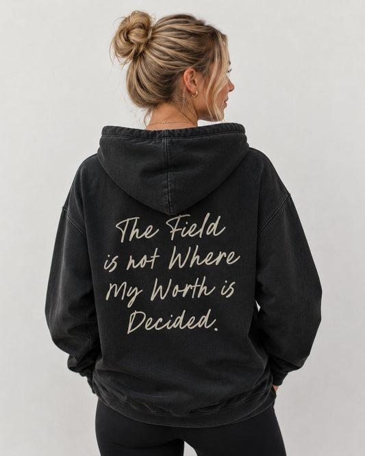THE FIELD IS NOT WHERE MY WORTH IS DECIDED HOODIE